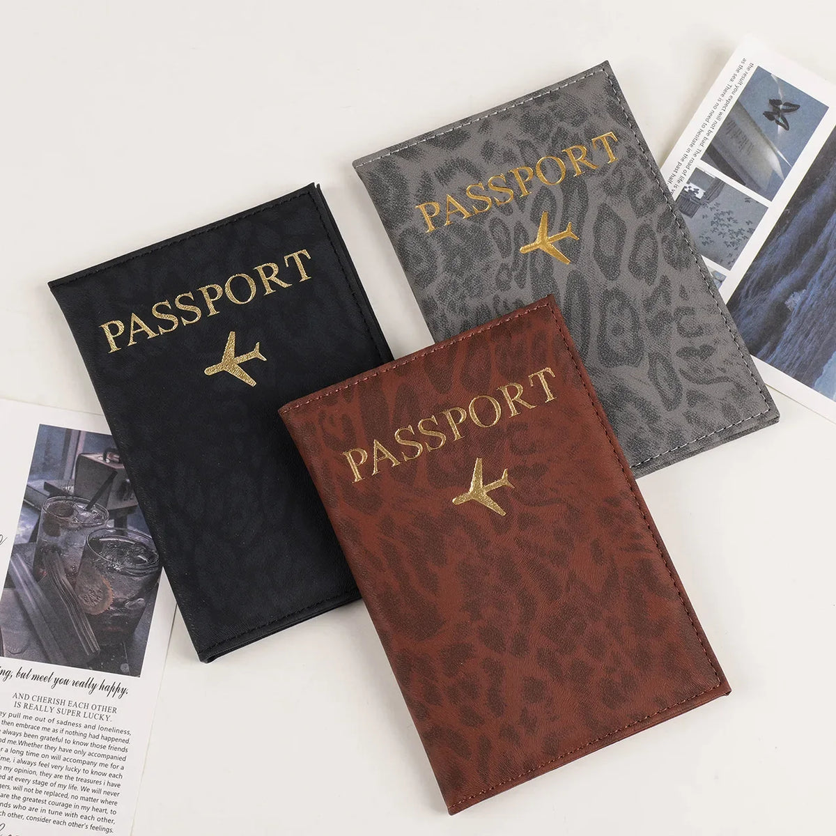 Three passport holders in black, grey, and brown leopard print PU leather.