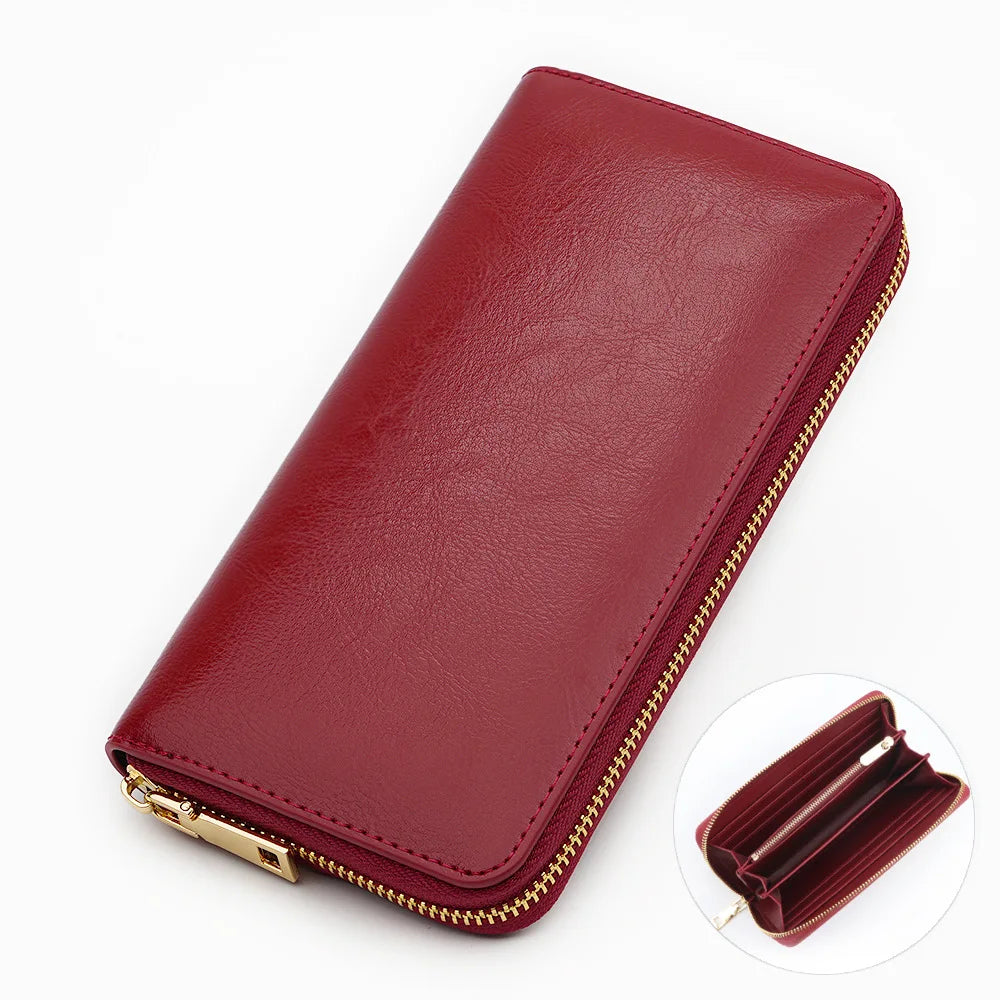 A maroon genuine leather zipper wallet shown from above and a close-up view of the interior.