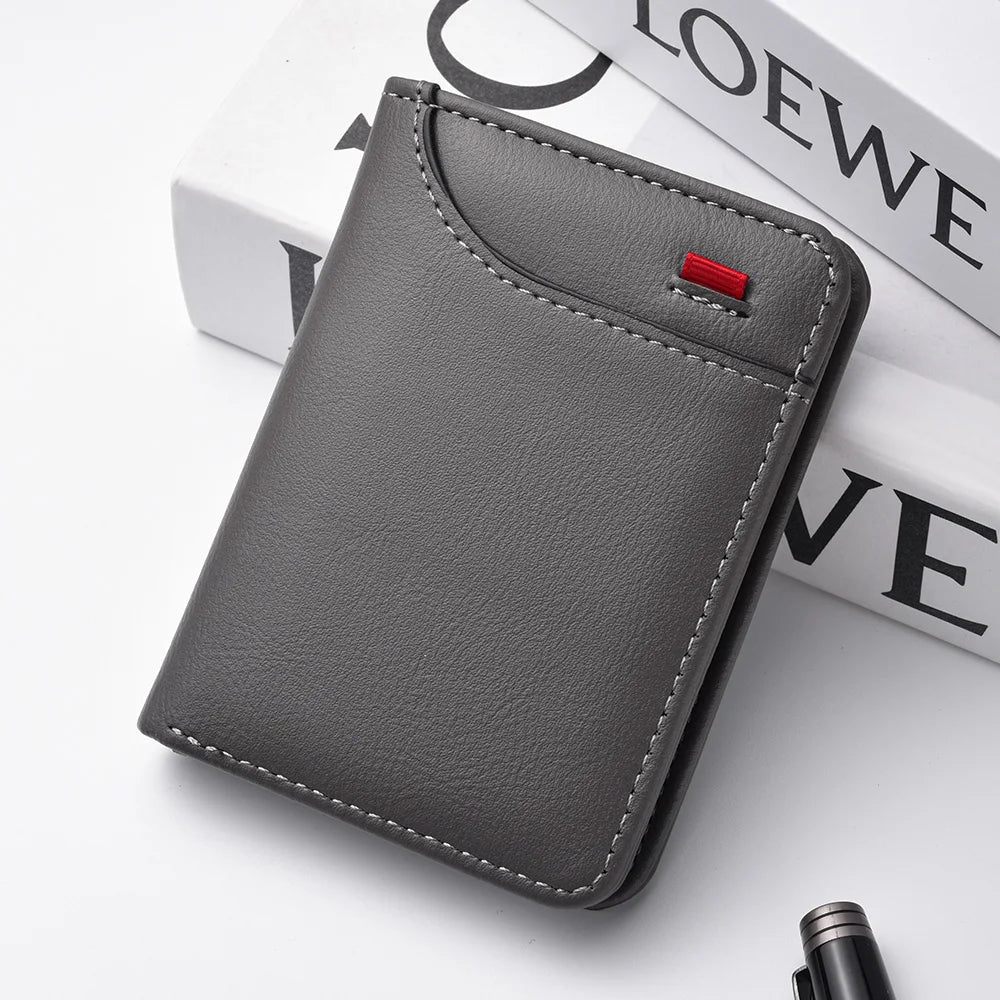 A dark gray ultra-thin PU leather credit card wallet for men resting on a white surface.