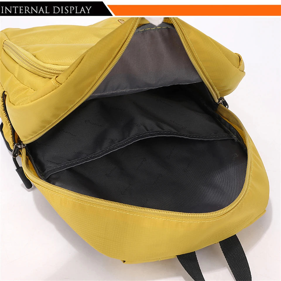 Internal display of a yellow fashion commuter daypack showing the interior lining.