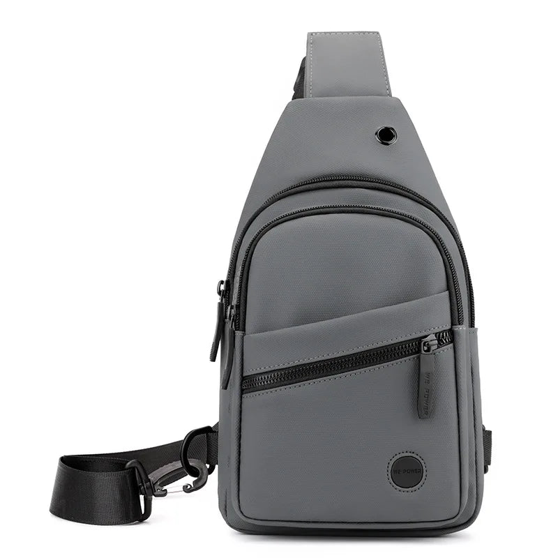 A gray lightweight nylon crossbody sling bag with a black strap and zippered compartments.