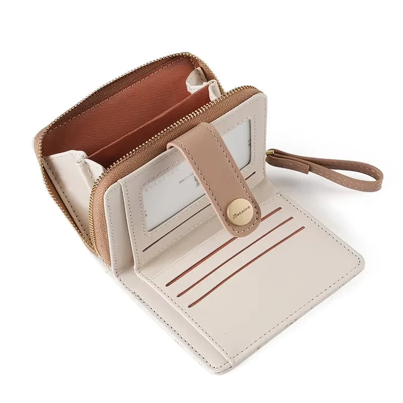 A light beige leather coin purse and card holder wallet with a brown lining and stitched details.