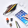An elegant leather pencil case filled with colored pencils is shown next to a tablet and various writing tools.