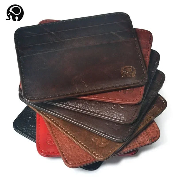 A stack of genuine brown and red leather slim card holder wallets.