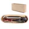 A tan felt purse organizer insert showing various small items like cards and a smartphone.