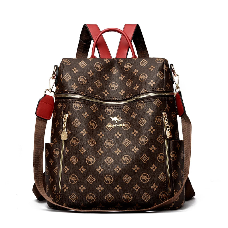A brown genuine leather women's backpack with red straps and gold hardware.
