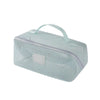A light mint green mesh pouch with a handle used for organizing cosmetics and toiletries.