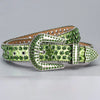 A decorative western buckle belt covered in green and silver rhinestones.