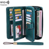 A dark green RFID protection multi-card wallet with a wrist strap, showing various cards and identification documents.
