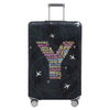 A black suitcase with a transparent grid pattern featuring various performance and arts related words like ballet, concert, o