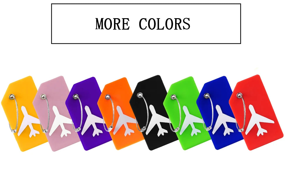 A row of colorful silicone luggage tags in various shades including yellow, pink, purple, orange, black, green, blue, and red