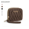 A brown quilted mini coin purse and card holder wallet with gold-toned zipper details.