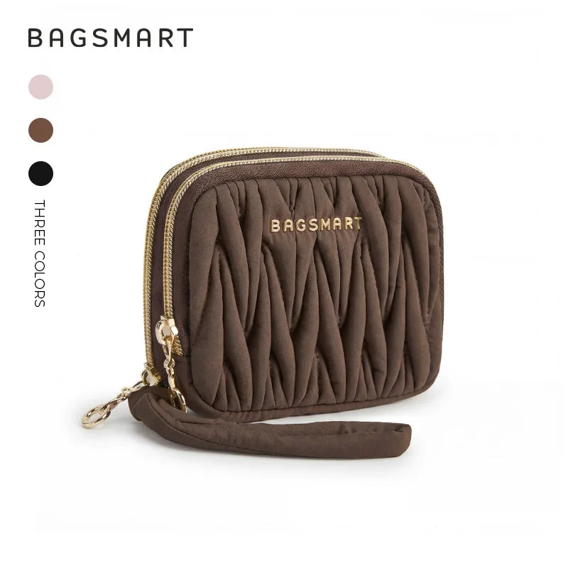 A brown quilted mini coin purse and card holder wallet with gold-toned zipper details.