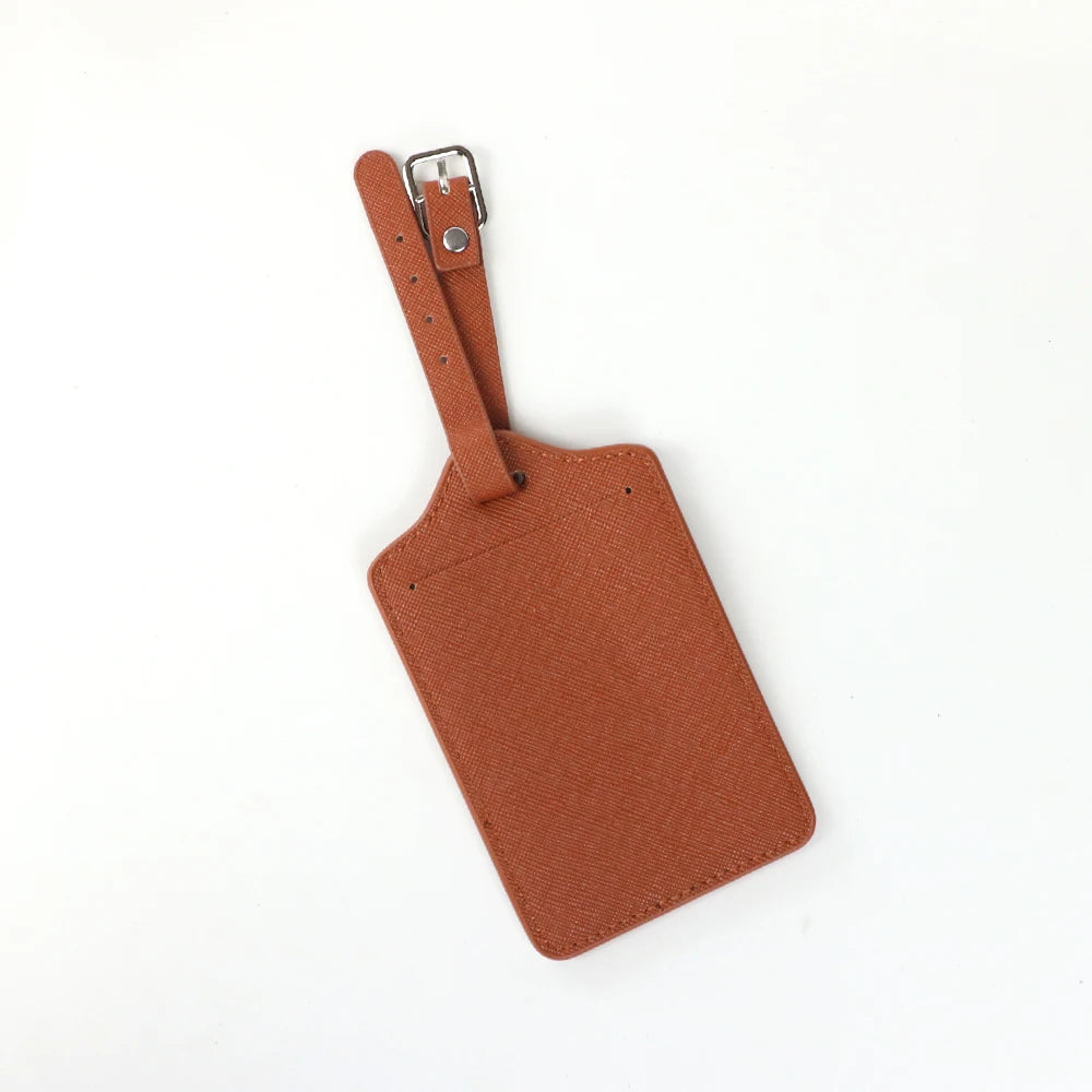 Two brown PU leather luggage tags with a leather strap and silver clasp.