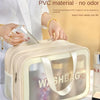 A beige PVC washbag with a clear window is shown next to a person holding a bottle.