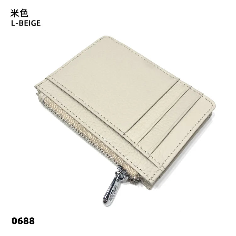 A beige genuine leather zipper card holder and coin purse shown from above.