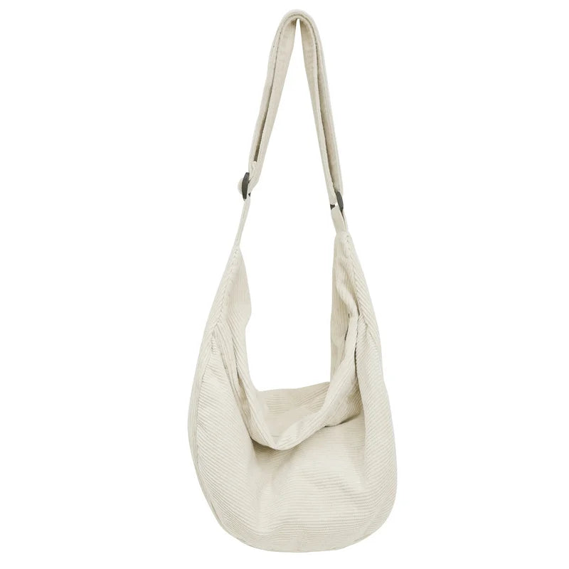 A beige corduroy casual crossbody shoulder bag with a drawstring closure.