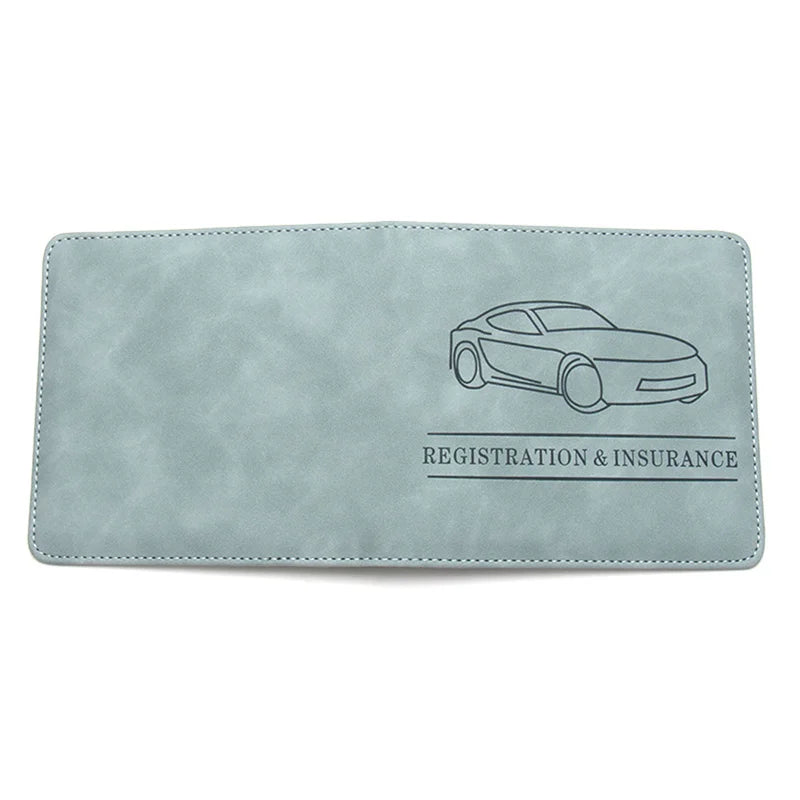 A light blue gray PU leather glove box wallet for registration and insurance with a line drawing of a car.