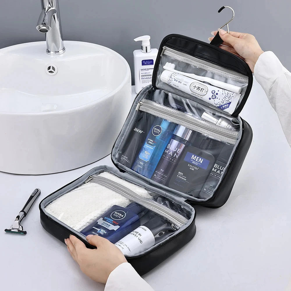 A hand opens a black portable PU leather cosmetic organizer bag revealing various grooming products.