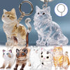 A collection of transparent cat fur keepsakes and figurines, including a golden cat pendant and various sculpted cat figures.