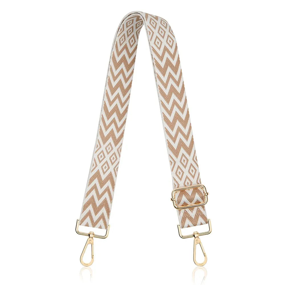 A beige and white chevron patterned nylon crossbody bag strap with gold-toned hardware.