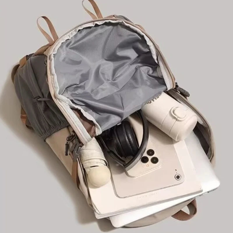 A beige and gray durable 80L waterproof hiking backpack shown from above.