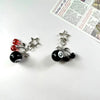 Silver Y2K 8 ball keychain charm with a star and a black marble ball.