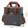 A gray insulated double-deck lunch bag with brown straps and buckles shown from the side.