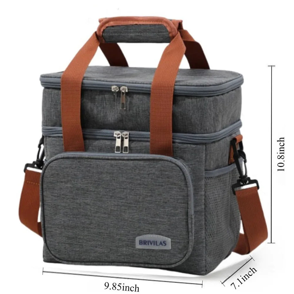 A gray insulated double-deck lunch bag with brown straps and buckles shown from the side.