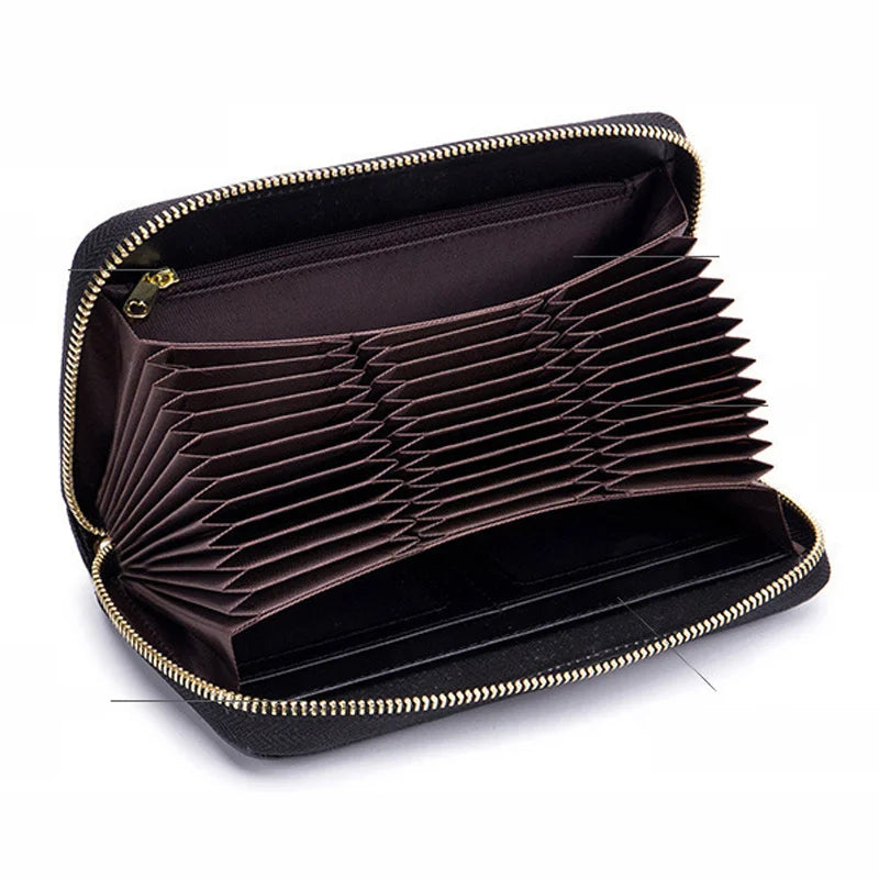 A dark brown genuine leather RFID women's travel wallet with a zipper closure, shown open.