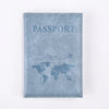 A light blue suede passport holder with the word PASSPORT and a world map design.
