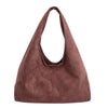 A deep reddish-brown suede shoulder tote bag with a drawstring closure.