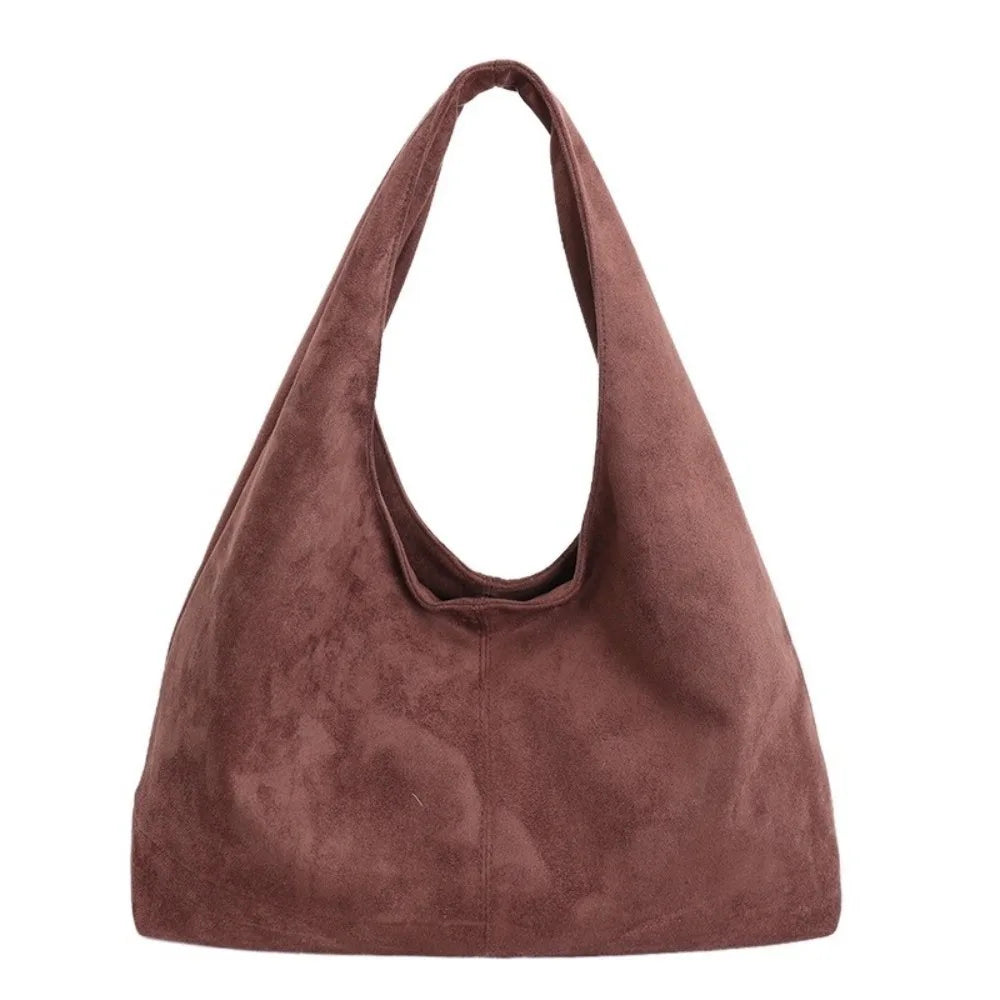 A deep reddish-brown suede shoulder tote bag with a drawstring closure.
