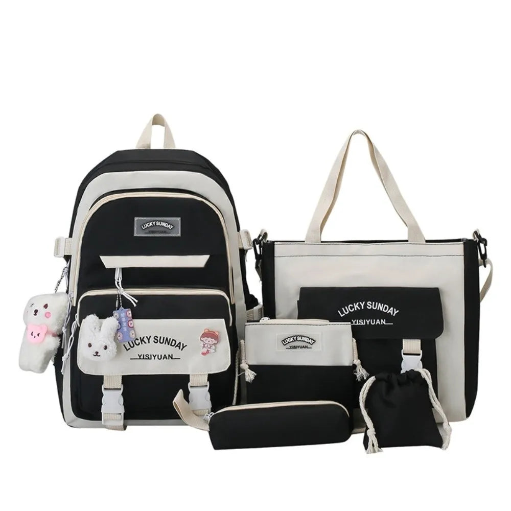 A set of five black and white nylon backpacks for students featuring a lucky sunday cartoon design.