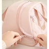 A hand is opening the zipper of a pink quilted insulated PU leather lunch tote bag.