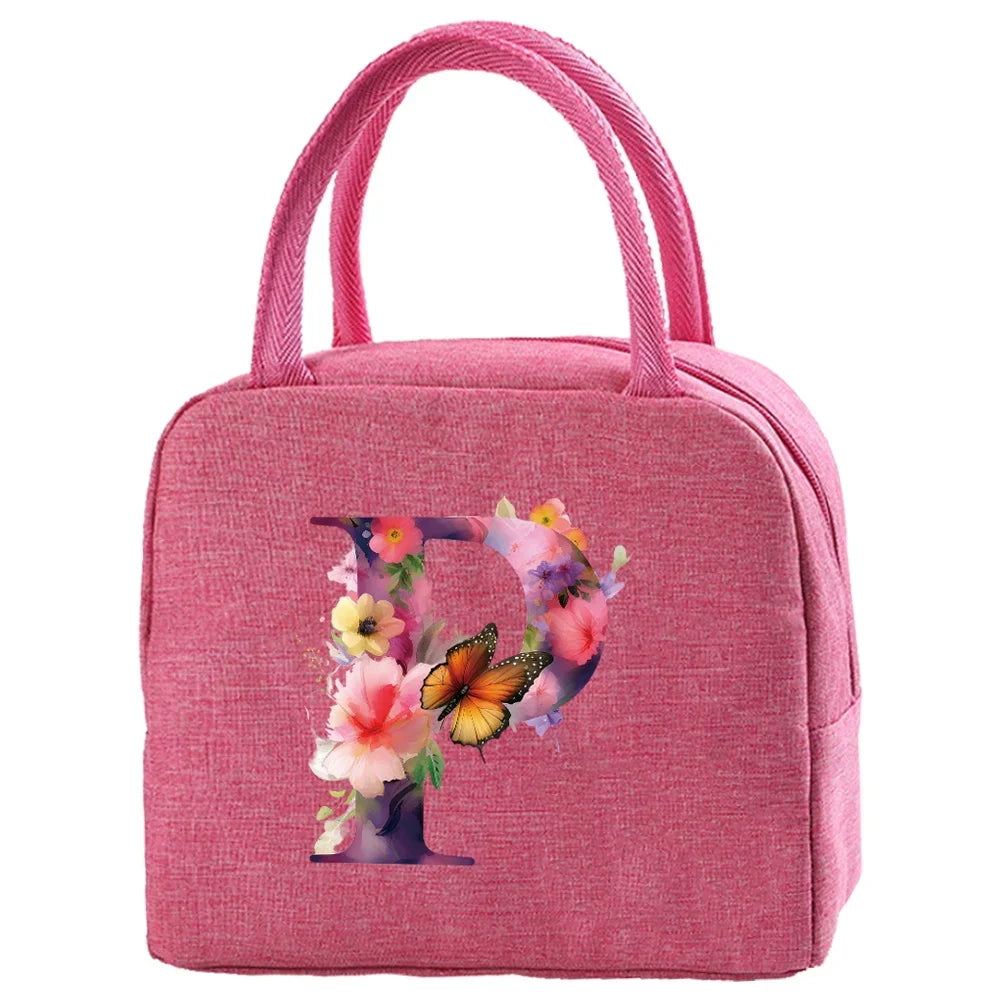 A pink insulated canvas lunch bag featuring a floral butterfly design.
