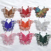 A collection of nine decorative rhinestone butterfly appliqués and stickers in various colors and shades