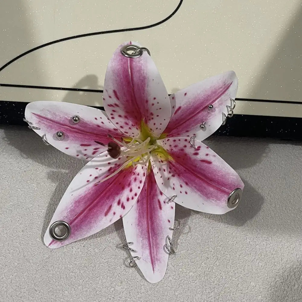 A realistic pink and white orchid flower crafted as a keychain.