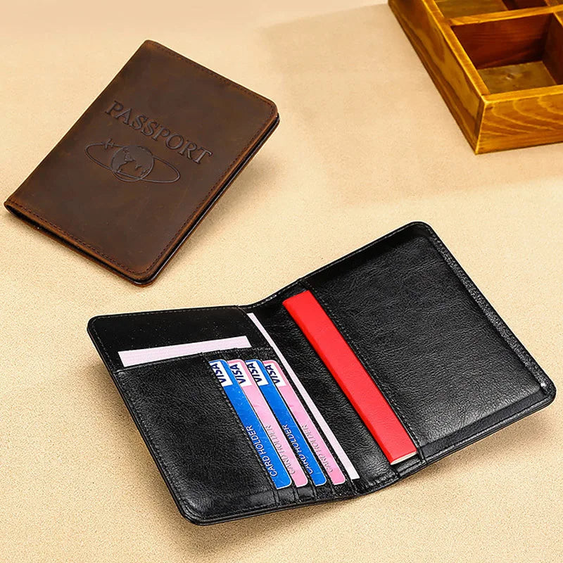 A black leather passport holder with slots for various cards and a brown leather passport wallet.