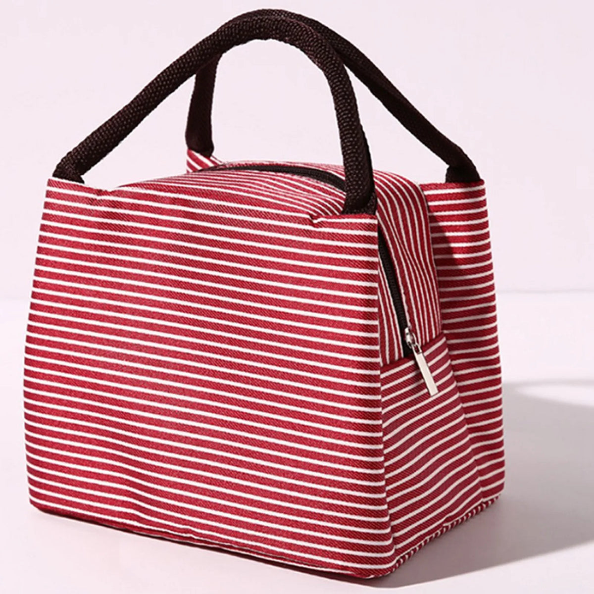 A red and white striped insulated lunch tote bag with a black adjustable shoulder strap.
