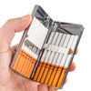 A hand holds an open premium metal cigarette holder displaying several white and orange-tipped cigarettes.