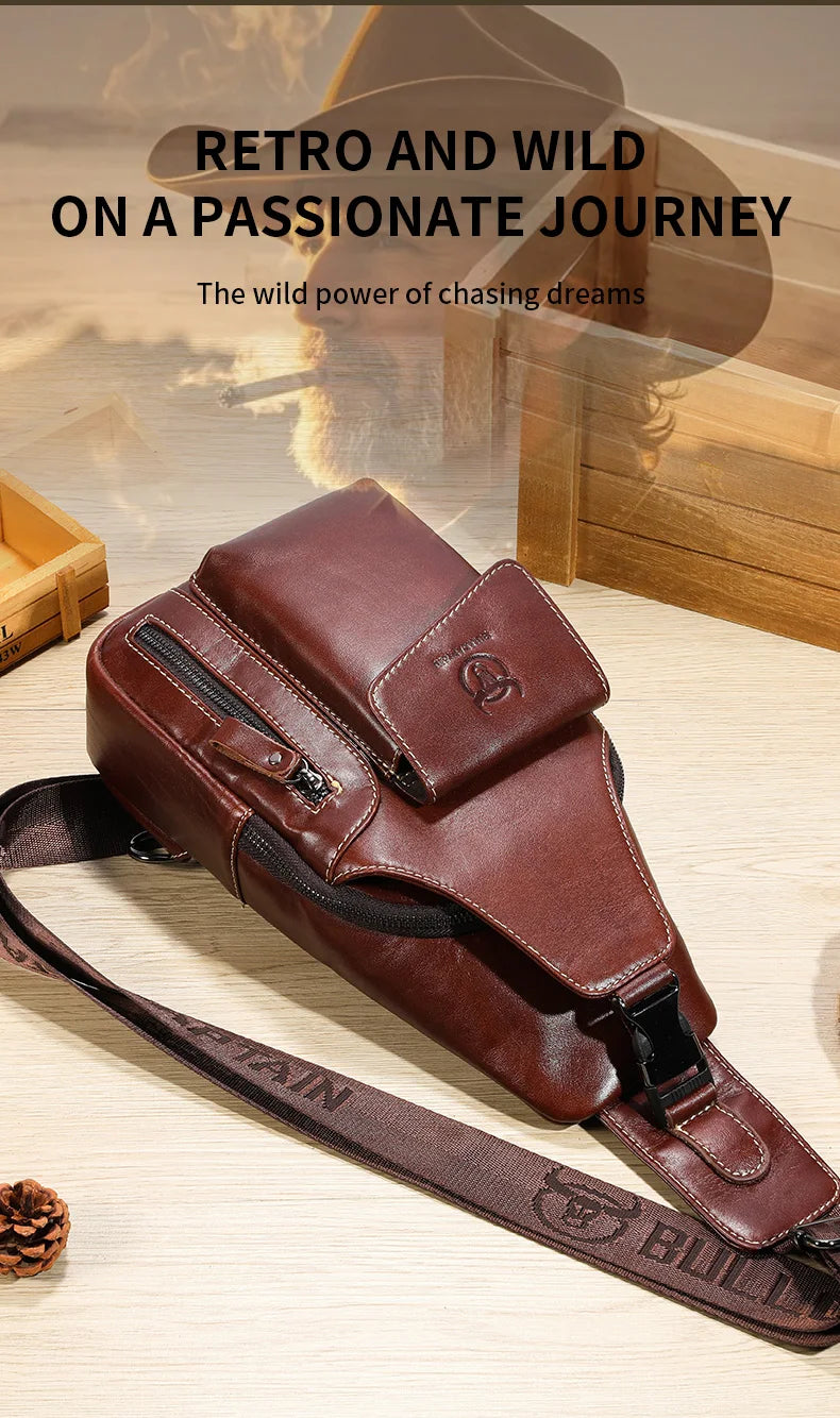 A brown genuine leather sling backpack is shown lying on a wooden surface with a leather strap.