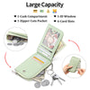 A light green ladies zip coin purse shown open with various compartments and a key ring.