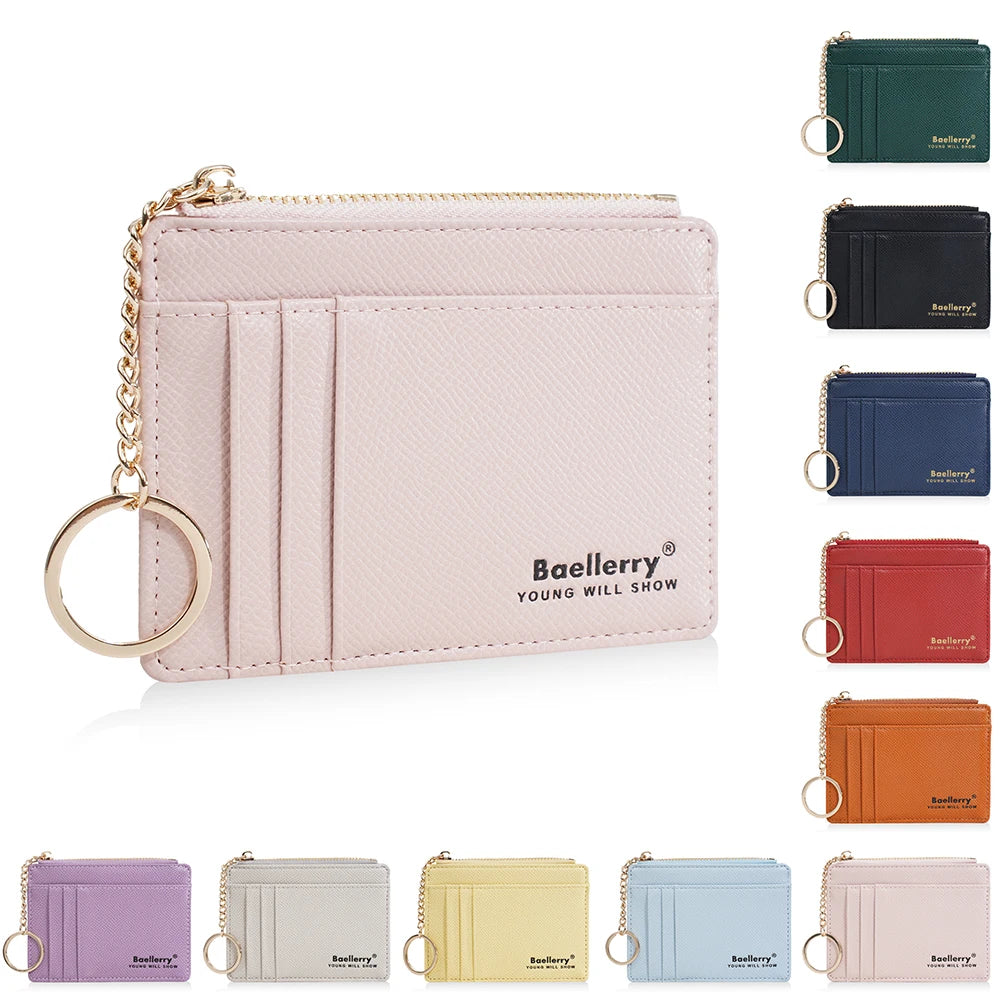 A collection of pink, black, blue, red, and orange card holder wallets with gold-tone keychains.