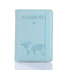 Light blue leather passport organizer with a world map and airplane icon embossed on the cover