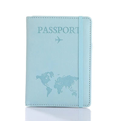 Light blue leather passport organizer with a world map and airplane icon embossed on the cover