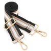 A black and beige striped nylon crossbody bag strap with gold-toned hardware.