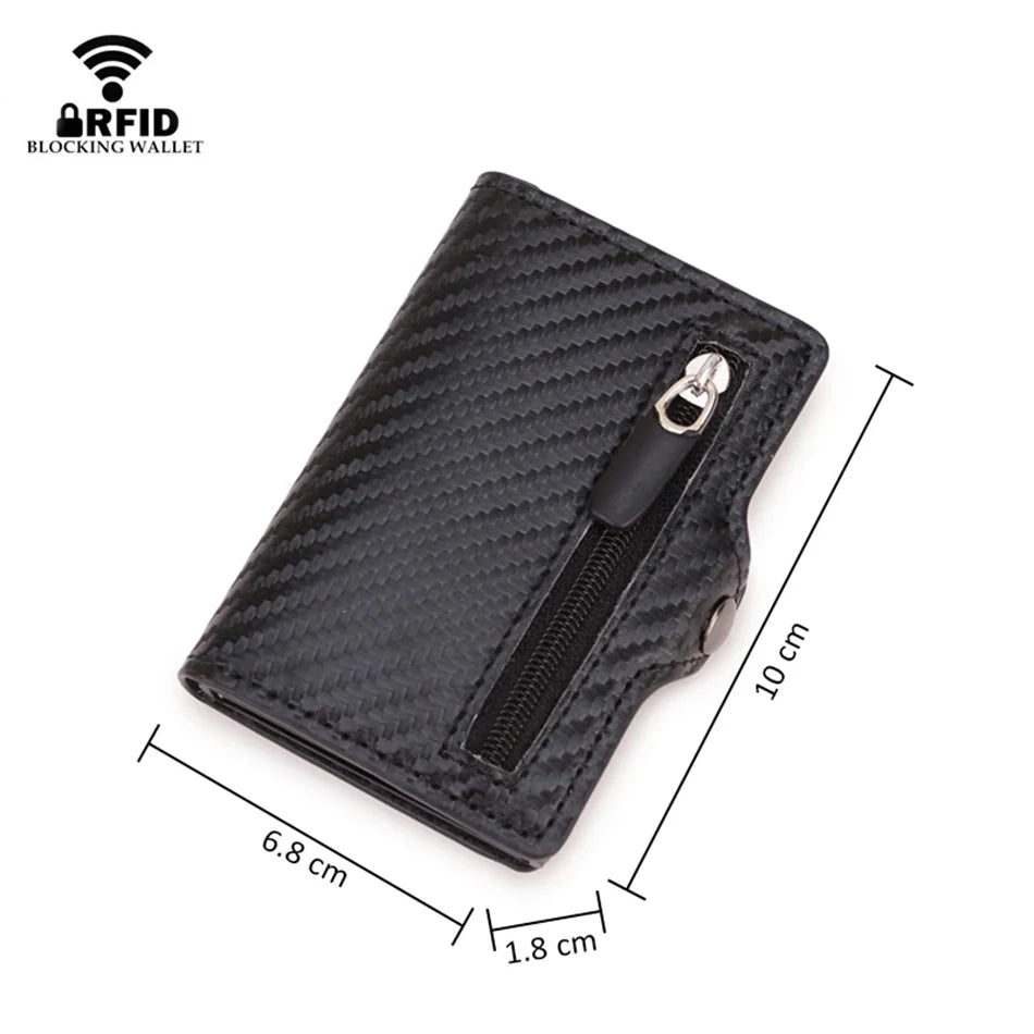 A black slim wallet with a carbon fiber texture and a zippered compartment is shown from above.
