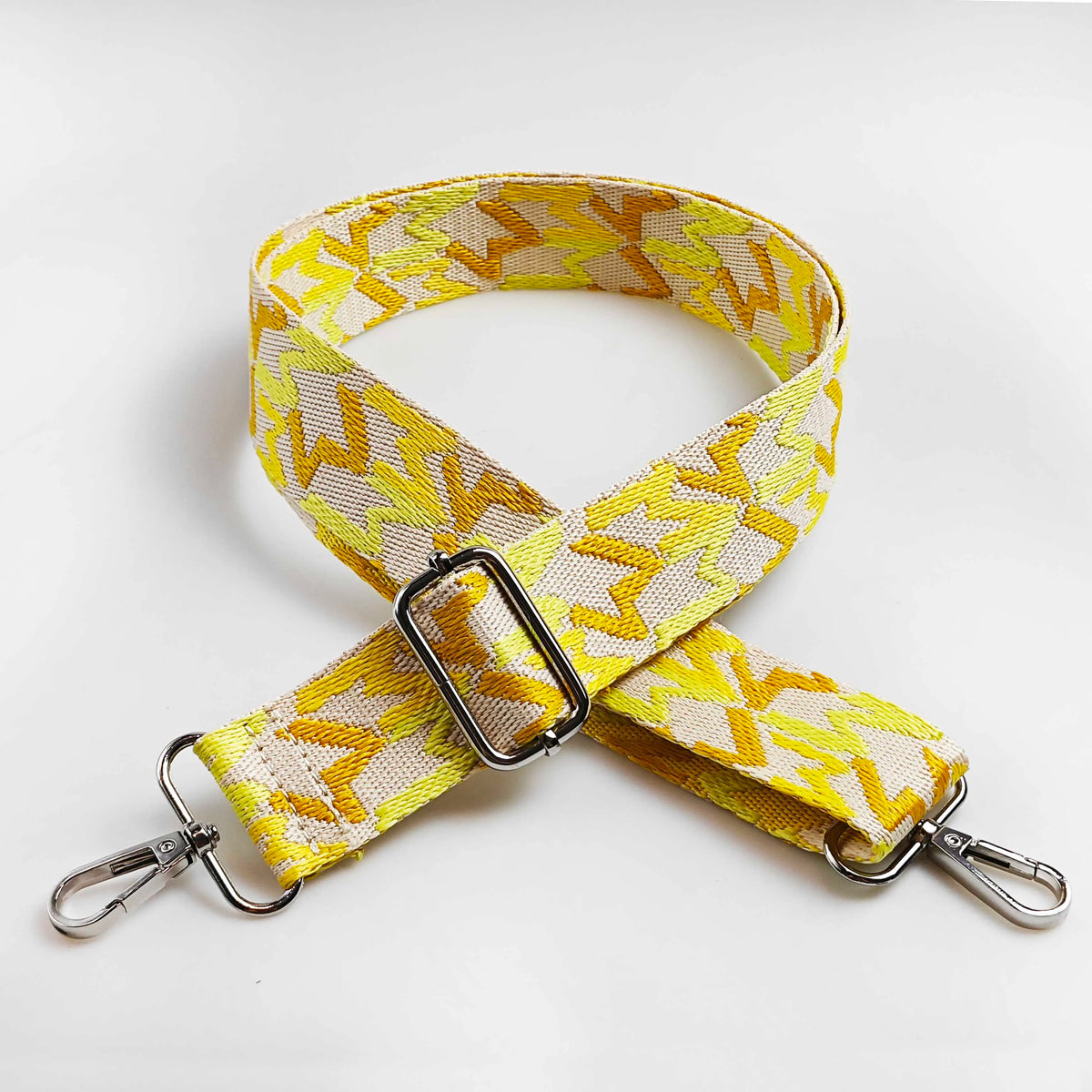 Yellow and beige jacquard patterned adjustable crossbody bag strap with metal hardware