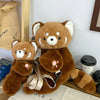 A brown red panda plush toy designed as a soft furry crossbody bag.